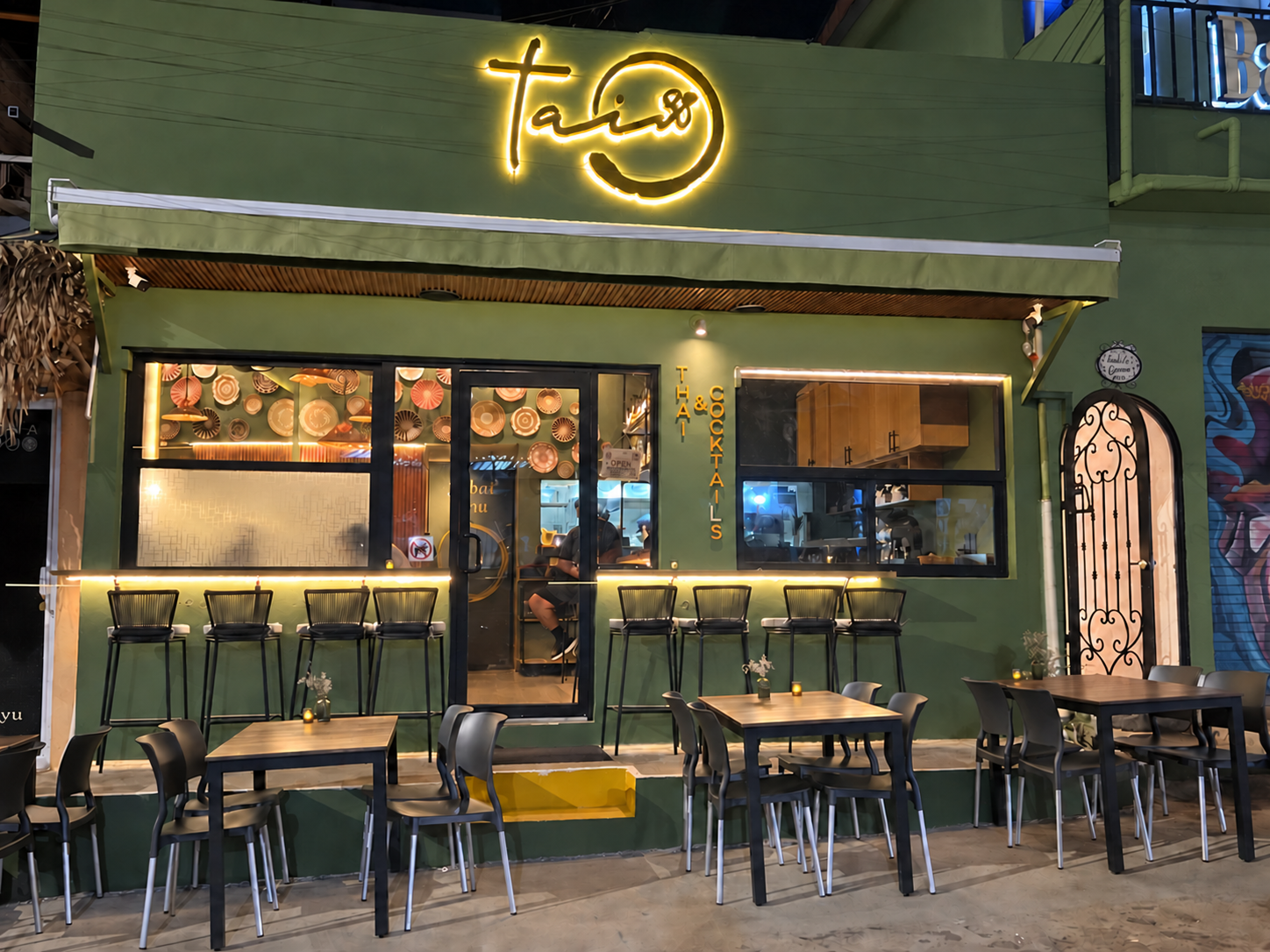 Tai38 restaurant facade in Sayulita, illuminated at night